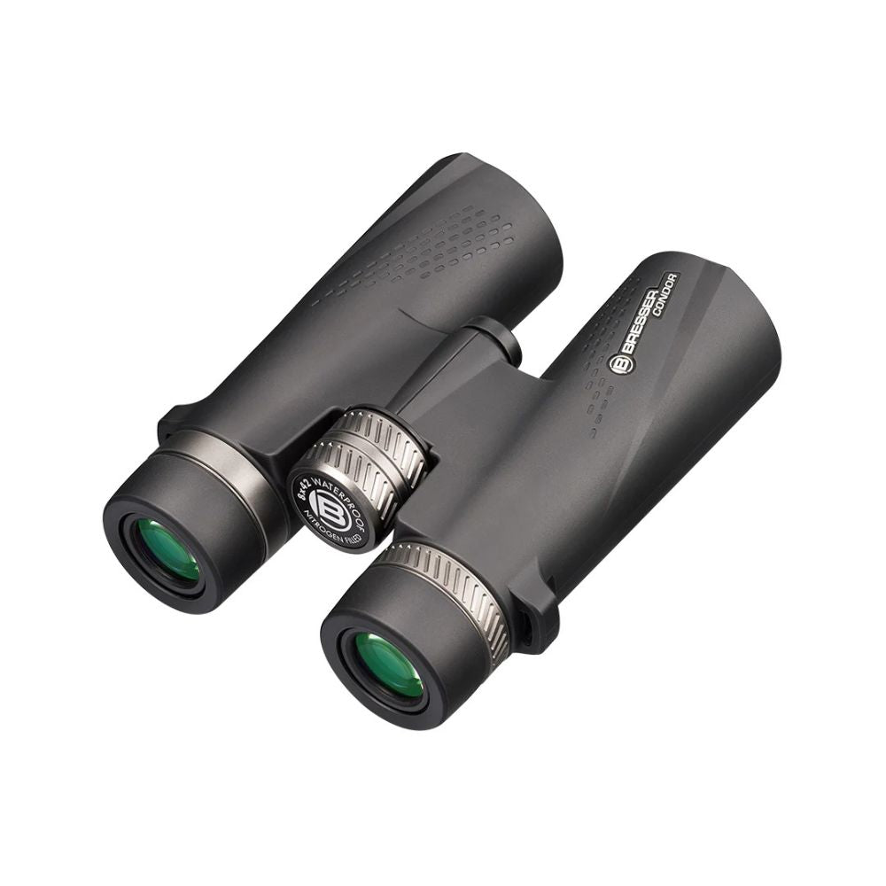 Black binoculars with green lenses on a white background