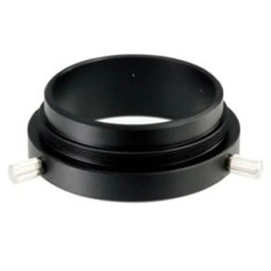 Black metal ring with two metallic studs on a white background